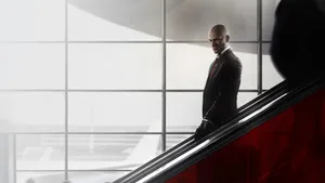 Hitman Hd Heading Down An Escalator Wallpaper