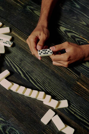 Holding Dominos Wallpaper