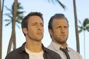 Hollywood Actors Scott Caan And Alex O'loughlin Posing For A Photoshoot Wallpaper