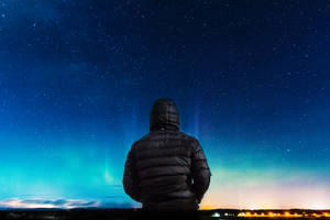 Hooded Guy In Blue Night Sky Wallpaper