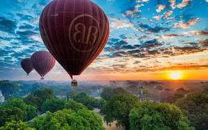 Hot Air Balloon Above A Park Wallpaper