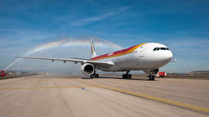 Iberia Airlines Airplane On Airport Runway Wallpaper