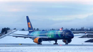 Icelandair Blue Airplane On Runway Wallpaper