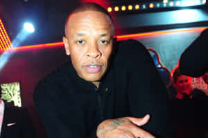 Iconic Music Producer Dr. Dre In His Studio Wallpaper
