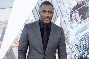 Idris Elba In Gray Suit And Black Inner Wallpaper