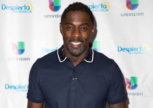 Idris Elba Wearing Navy Blue Polo Wallpaper