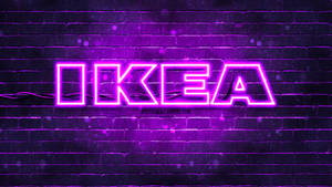 Illuminated Ikea Logo Against Brick Wall Backdrop Wallpaper