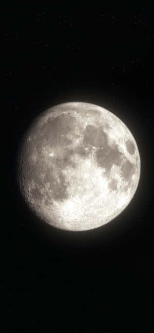 Illuminating Moon Over A Dark Landscape - Shot On Iphone Wallpaper