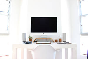 Imac On Top Of Table Wallpaper