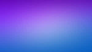 Image A Purple Laptop On A Marble Table Wallpaper