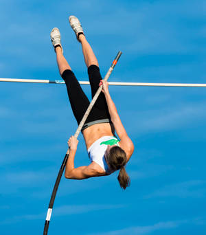 Impressive Female Pole Vault Athlete Wallpaper