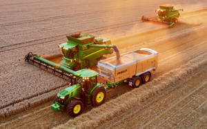 Innovative Agriculture With John Deere Tractor And Harvesters Wallpaper