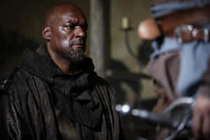 Intense_ Gaze_ In_ Dramatic_ Setting Wallpaper