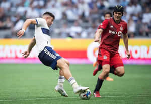 Intense Soccer Match Duel Wallpaper