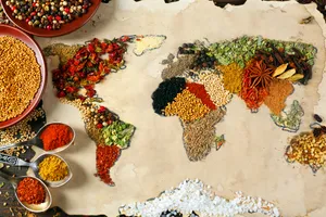 Intricate World Map Formed By Vibrant Grains Wallpaper
