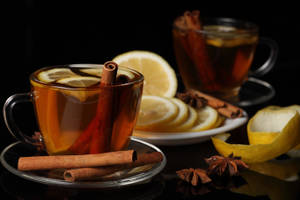 Invigorating Hot Tea With Cinnamon Sticks Wallpaper