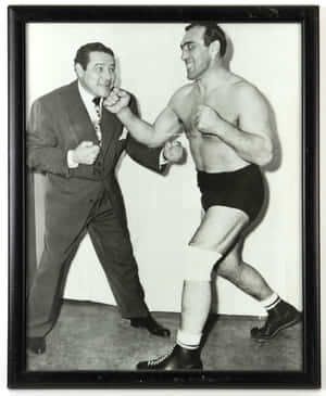 Italian Professional Boxer Primo Carnera In A Boxing Stance Wallpaper