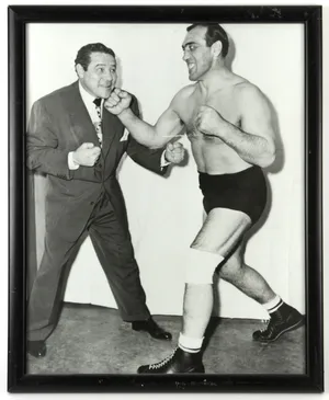 Italian Professional Boxer Primo Carnera In A Boxing Stance Wallpaper