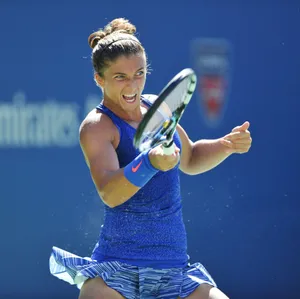 Italian Professional Tennis Player Sara Errani Showcasing A Committed Expression During A Match. Wallpaper