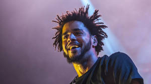 J Cole Smiling At Concert Wallpaper