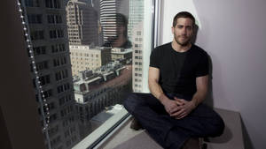 Jake Gyllenhaal By The Window Wallpaper