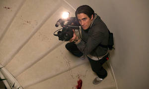 Jake Gyllenhaal Holding A Camera Wallpaper