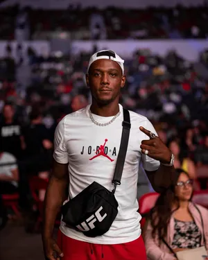 Jamahal Hill Against Blurry Crowd Wallpaper