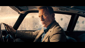 James Bond On Car No Time To Die Wallpaper