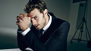 Jamie Dornan Posing In A Stylish Attire Wallpaper