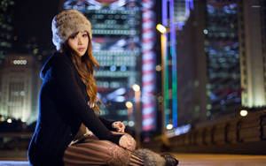 Japanese Girl In City At Night Wallpaper