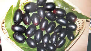 Java Plums Inside Weave Basket Wallpaper