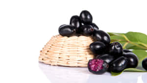 Java Plums On A Turned Over Wicker Basket Wallpaper