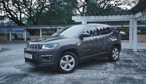 Jeep Compass On Gray Concrete Floor Wallpaper