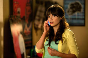 Jessica Day From New Girl Showcasing Her Signature Bangs Wallpaper