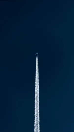 Jet Contrail Against Blue Sky Wallpaper