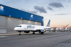 Jetblue Airways Plane By The Airport Hangar Wallpaper