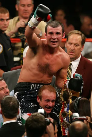 Joe Calzaghe Carried By His Coach Wallpaper