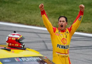 Joey Logano Cheering In Victory Wallpaper