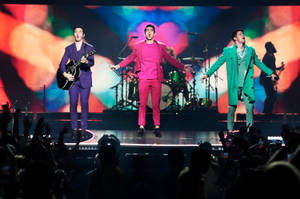 Jonas Brothers In Colorful Outfits Wallpaper