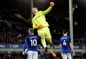 Jordan Pickford Jumping In The Air Wallpaper