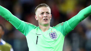 Jordan Pickford Raising Arms In Green Wallpaper