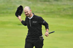 Joyful Golfer Celebrating Shot Wallpaper