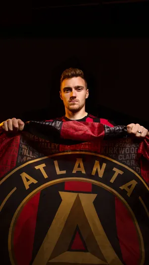 Julian Gressel Holding Atlanta United Fc Flag Wallpaper