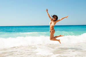 Jumping Beach Woman Bikini Wallpaper