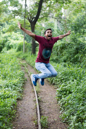 Jumping Near A Railroad Trail Wallpaper