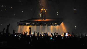 Kanye West Saint Pablo Standing Over Crowds Wallpaper