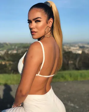 Karol G Backless Dress Photography Wallpaper