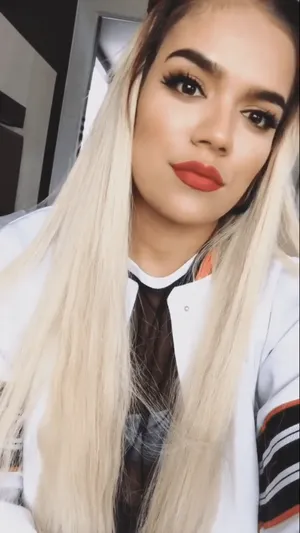 Karol G School Girl Outfit Wallpaper