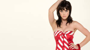 Katy Perry In Cozy Christmas Dress Wallpaper