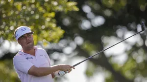 Keith Mitchell Holding A Golf Club Wallpaper